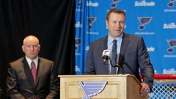 Jan 29, 2015; St. Louis, MO, USA; Saint Louis Blues general manager Doug Armstrong (left) looks on as Martin Brodeur addresses the media during a press conference at Scottrade Center. Mandatory Credit: Scott Kane-USA TODAY Sports