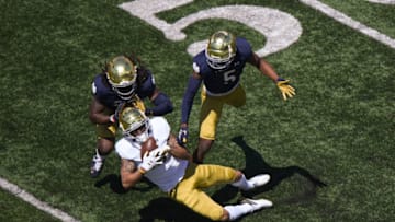 SOUTH BEND, INDIANA - MAY 01: Joe Wilkins Jr. #18 of the Notre Dame Fighting Irish catches the football in the first half against Cam Hart #5 of the Notre Dame Fighting Irish Blue-Gold Spring Game at Notre Dame Stadium on May 01, 2021 in South Bend, Indiana. (Photo by Quinn Harris/Getty Images)