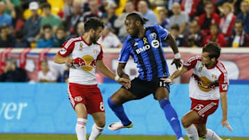 Sep 24, 2016; Harrison, NJ, USA; New York Red Bulls midfielder Felipe Martins (8) and Montreal Impact forward Didier Drogba (11) and New York Red Bulls midfielder Salvatore Zizzo (15) battle for the ball during first half at Red Bull Arena. Mandatory Credit: Noah K. Murray-USA TODAY Sports