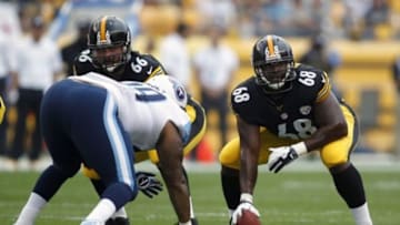 Sep 8, 2013; Pittsburgh, PA, USA; Pittsburgh Steelers tackle Kelvin Beachum (68) moves to play center after center Maurkice Pouncey (53) left the game with an apparent injury against the Tennessee Titans during the first quarter at Heinz Field. Mandatory Credit: Charles LeClaire-USA TODAY Sports