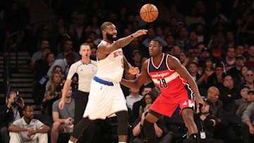 Oct 10, 2016; New York, NY, USA; New York Knicks forward Kyle O'Quinn (9) passes the ball in front of Washington Wizards center Ian Mahinmi (28) during the second quarter at Madison Square Garden. Mandatory Credit: Anthony Gruppuso-USA TODAY Sports