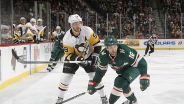 ST. PAUL, MN - OCTOBER 28: Jason Zucker #16 of the Minnesota Wild defends Kris Letang #58 of the Pittsburgh Penguins during the game at the Xcel Energy Center on October 28, 2017 in St. Paul, Minnesota. (Photo by Bruce Kluckhohn/NHLI via Getty Images)