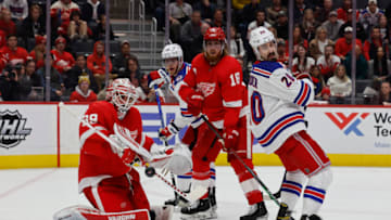 Mar 30, 2022; Detroit, Michigan, USA; Detroit Red Wings goaltender Alex Nedeljkovic (39) makes a save in front of New York Rangers left wing Chris Kreider (20) in the third period at Little Caesars Arena. Mandatory Credit: Rick Osentoski-USA TODAY Sports