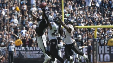 September 20, 2015; Oakland, CA, USA; Oakland Raiders wide receiver Amari Cooper (89, left) is fouled by Baltimore Ravens cornerback Jimmy Smith (22, center) for a defensive holding penalty as Ravens free safety Kendrick Lewis (23) assists during the third quarter at O.co Coliseum. The Raiders defeated the Ravens 37-33. Mandatory Credit: Kyle Terada-USA TODAY Sports