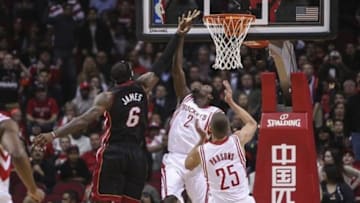 Mar 4, 2014; Houston, TX, USA; Miami Heat small forward LeBron James (6) shoots during the first quarter as Houston Rockets point guard Patrick Beverley (2) defends at Toyota Center. Mandatory Credit: Troy Taormina-USA TODAY Sports