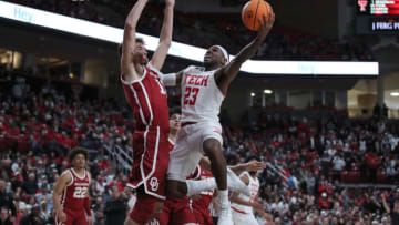 Jan 7, 2023; Lubbock, Texas, USA; Texas Tech Red Raiders guard De’Vion Harmon (23) shoots the ball against Oklahoma Sooners forward Sam Godwin (10) in the second half at United Supermarkets Arena. Mandatory Credit: Michael C. Johnson-USA TODAY Sports