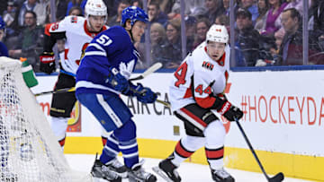 TORONTO, ON - FEBRUARY 06: Ottawa Senators Center Jean-Gabriel Pageau (44) and Toronto Maple Leafs Defenceman Jake Gardiner (51) fight for the puck during the regular season NHL game between the Ottawa Senators and Toronto Maple Leafs on February 6, 2019 at Scotiabank Arena in Toronto, ON. (Photo by Gerry Angus/Icon Sportswire via Getty Images)