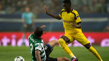 LISBON, PORTUGAL - OCTOBER 18: Ezequiel Schelotto of SC Sporting competes for the ball with Ousmane DembÃ©lÃ© of Borussia Dortmund during the UEFA Champions League match between SC Sporting and Borussia Dortmund at Estadio Jose Alvalade on October 18, 2016 in Lisbon, Lisboa. (Photo by Octavio Passos/Getty Images)