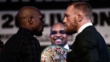 LAS VEGAS, NV - AUGUST 23: (L-R) Boxer Floyd Mayweather Jr. and UFC lightweight champion Conor McGregor face off during a news conference at the KA Theatre at MGM Grand Hotel