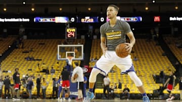 Apr 18, 2016; Oakland, CA, USA; Golden State Warriors guard Stephen Curry (30) dribbles the ball during warm ups before the start of the game against the Houston Rockets in game two of the first round of the NBA Playoffs at Oracle Arena. Mandatory Credit: Cary Edmondson-USA TODAY Sports