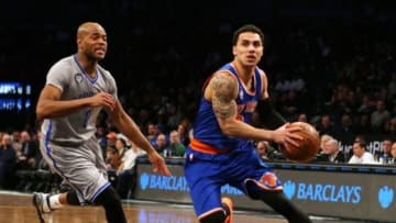 Feb 6, 2015; Brooklyn, NY, USA; New York Knicks guard Shane Larkin (0) drives past Brooklyn Nets guard Jarrett Jack (0) during the second quarter at Barclays Center. Mandatory Credit: Adam Hunger-USA TODAY Sports