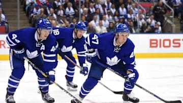 Oct 15, 2016; Toronto, Ontario, CAN; Toronto Maple Leafs forwards Leo Komarov (47) and Milan Michalek (18) and defenceman Morgan Rielly (44) line up for a face off against Boston Bruins at Air Canada Centre. Mandatory Credit: Dan Hamilton-USA TODAY Sports