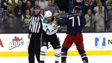 Oct 14, 2014; Columbus, OH, USA; Columbus Blue Jackets left wing Nick Foligno (71) and Dallas Stars left wing Jamie Benn (14) fight during the second period at Nationwide Arena. Mandatory Credit: Russell LaBounty-USA TODAY Sports