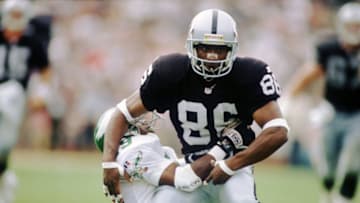 24 SEP 1995: WIDE RECEIVER RAGHIB "ROCKET" ISMAIL OF THE OAKLAND BATTLES A PHILADELPHIA EAGLES DEFENDER DURING THE RAIDER''S 48-17 WIN AT THE OAKLAND COLISEUM IN OAKLAND, CALIFORNIA. Mandatory Credit: Al Bello/ALLSPORT