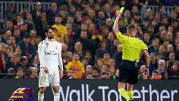BARCELONA, SPAIN - DECEMBER 18: Isco Alarcon of Real Madrid is shown a yellow card by referee Hernandez Hernandez during the Liga match between FC Barcelona and Real Madrid CF at Camp Nou on December 18, 2019 in Barcelona, Spain. (Photo by Quality Sport Images/Getty Images)