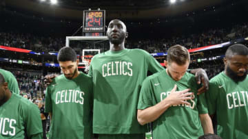 BOSTON, MA - OCTOBER 6: Enes Kanter #11 of the Boston Celtics, Tacko Fall #99 of the Boston Celtics, and Gordon Hayward #20 of the Boston Celtics stands for the national anthem before the game against the Charlotte Hornets on October 6, 2019 at the TD Garden in Boston, Massachusetts. NOTE TO USER: User expressly acknowledges and agrees that, by downloading and or using this photograph, User is consenting to the terms and conditions of the Getty Images License Agreement. Mandatory Copyright Notice: Copyright 2019 NBAE (Photo by Brian Babineau/NBAE via Getty Images)