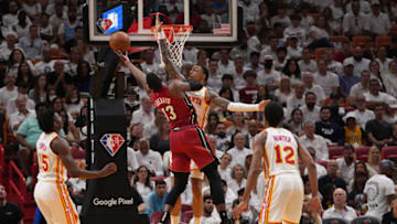 Miami Heat center Bam Adebayo (13) puts up a shot around Atlanta Hawks forward John Collins (20)(Jasen Vinlove-USA TODAY Sports)