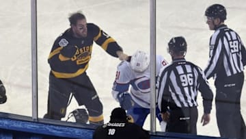 Jan 1, 2016; Foxborough, MA, USA; Boston Bruins right wing Jimmy Hayes (11) fights with Montreal Canadiens center Lars Eller (81) during the third period in the Winter Classic hockey game at Gillette Stadium. Mandatory Credit: Bob DeChiara-USA TODAY Sports