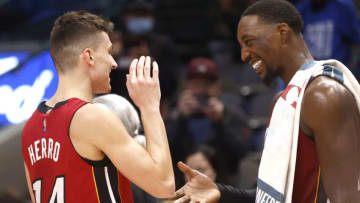 Tyler Herro #14 and Bam Adebayo #13 of the Miami Heat celebrate the teams 125-110 win over the Dallas Mavericks(Photo by Ron Jenkins/Getty Images)