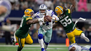 ARLINGTON, TX - OCTOBER 6: Dak Prescott #4 of the Dallas Cowboys tries to run the ball but is sacked by Preston Smith #91 of the Green Bay Packers at AT&T Stadium on October 6, 2019 in Arlington, Texas. (Photo by Wesley Hitt/Getty Images)