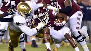 Oct 31, 2015; Philadelphia, PA, USA; Temple Owls running back Jahad Thomas (5) is tackled by Notre Dame Fighting Irish defensive lineman Daniel Cage (75) during the first quarter at Lincoln Financial Field. Mandatory Credit: Derik Hamilton-USA TODAY Sports