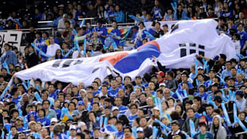 SAN DIEGO - MARCH 17: A Korean flag gets passed down through the stands as Korea plays against Japan during the 2009 World Baseball Classic Round 2 Pool 1 Game 4 on March 17, 2009 at Petco Park in San Diego, California. (Photo by Kevork Djansezian/Getty Images)