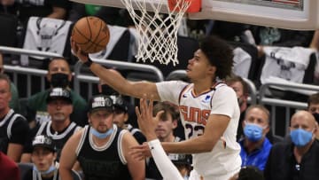 MILWAUKEE, WISCONSIN - JULY 11: Cameron Johnson #23 of the Phoenix Suns goes up for a reverse layup during the second half in Game Three of the NBA Finals against the Milwaukee Bucks at Fiserv Forum on July 11, 2021 in Milwaukee, Wisconsin. NOTE TO USER: User expressly acknowledges and agrees that, by downloading and or using this photograph, User is consenting to the terms and conditions of the Getty Images License Agreement. (Photo by Justin Casterline/Getty Images)