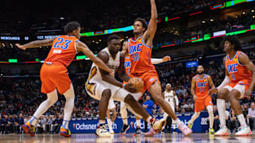Pelicans forward Zion Williamson (1) dribbles against OKC Thunder guard Tre Mann (23) and forward Jeremiah Robinson-Earl. Stephen Lew-USA TODAY Sports