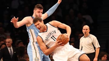 Dec 7, 2016; Brooklyn, NY, USA; Brooklyn Nets center Brook Lopez (11) drives against Denver Nuggets center Jusuf Nurkic (23) during the second quarter at Barclays Center. Mandatory Credit: Anthony Gruppuso-USA TODAY Sports