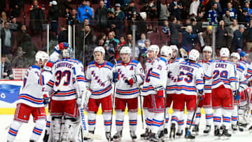 VANCOUVER, BC - FEBRUARY 28: Henrik Lundqvist #30 of the New York Rangers is congratulated by teammates after after their overtime win during their NHL game against the Vancouver Canucks at Rogers Arena February 28, 2018 in Vancouver, British Columbia, Canada. (Photo by Jeff Vinnick/NHLI via Getty Images)"n