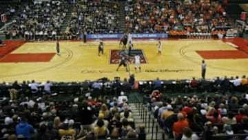 Nov 28, 2013; Lake Buena Vista, FL, USA; Purdue Boilermakers center A.J. Hammons (20) and Oklahoma State Cowboys post Michael Cobbins (20) tip off to start the first half of their Old Spice Classic game at HP Field House. Mandatory Credit: Phil Sears-USA TODAY Sports