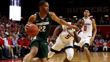 PISCATAWAY, NJ - DECEMBER 05: Miles Bridges #22 of the Michigan State Spartans drives for the net as Mike Williams #5 of the Rutgers Scarlet Knights defends on December 5, 2017 at the Rutgers Athletic Center in Piscataway, New Jersey. (Photo by Elsa/Getty Images)