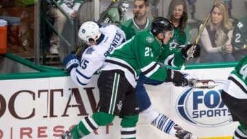 Nov 10, 2015; Dallas, TX, USA; Dallas Stars left wing Antoine Roussel (21) checks Toronto Maple Leafs right wing P.A. Parenteau (15) during the first period at the American Airlines Center. Mandatory Credit: Jerome Miron-USA TODAY Sports