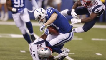 Oct 18, 2015; Indianapolis, IN, USA; Indianapolis Colts wide receiver Griff Whalen (17) is tackled by New England Patriots defensive back Brandon King (36) and cornerback Duron Harmon in the first half during the NFL game at Lucas Oil Stadium. Mandatory Credit: Brian Spurlock-USA TODAY Sports