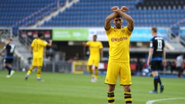 PADERBORN, GERMANY - MAY 31: Achraf Hakimi Mouh of Borussia Dortmund celebrates scoring his teams fourth goal of the game during the Bundesliga match between SC Paderborn 07 and Borussia Dortmund at Benteler Arena on May 31, 2020 in Paderborn, Germany. (Photo by Lars Baron/Getty Images)
