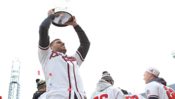 Nov 5, 2021; Atlanta, GA, USA; Atlanta Braves first baseman Freddie Freeman holds the Commissioner's Trophy during the World Series championship rally at Truist Park. Mandatory Credit: Brett Davis-USA TODAY Sports