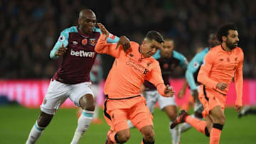 LONDON, ENGLAND - NOVEMBER 04: Roberto Firmino of Liverpool and Angelo Ogbonna of West Ham United in action during the Premier League match between West Ham United and Liverpool at London Stadium on November 4, 2017 in London, England. (Photo by Shaun Botterill/Getty Images)