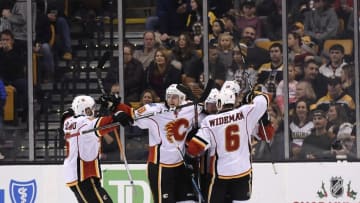 Nov 25, 2016; Boston, MA, USA; Calgary Flames right wing Alex Chiasson (39) (left) reacts with his teammates after scoring a goal during the third period against the Boston Bruins at TD Garden. Mandatory Credit: Bob DeChiara-USA TODAY Sports