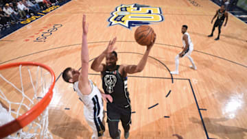 DENVER, CO - APRIL 1: Jabari Parker #12 of the Milwaukee Bucks goes to the basket against the Denver Nuggets on April 1, 2018 at the Pepsi Center in Denver, Colorado. NOTE TO USER: User expressly acknowledges and agrees that, by downloading and/or using this Photograph, user is consenting to the terms and conditions of the Getty Images License Agreement. Mandatory Copyright Notice: Copyright 2018 NBAE (Photo by Garrett Ellwood/NBAE via Getty Images)