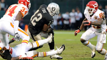 OAKLAND, CA - NOVEMBER 7: Jacoby Ford #12 of the Oakland Raiders runs with the ball after taking the catch away from Brandon Flowers #24 of the Kansas City Chiefs during an NFL football game at The Oakland-Alameda County Coliseum November 7, 2010 in Oakland, California. The Raiders won the game in overtime 23-20. (Photo by Thearon W. Henderson/Getty Images)