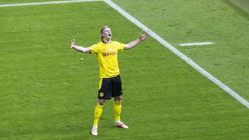 BERLIN, GERMANY - MAY 13: Erling Haaland of Dortmund celebrates scoring the 2:0 goal during the DFB Cup final match between RB Leipzig and Borussia Dortmund at Olympic Stadium on May 13, 2021 in Berlin, Germany. Sporting stadiums around Germany remain under strict restrictions due to the Coronavirus Pandemic as Government social distancing laws prohibit fans inside venues resulting in games being played behind closed doors. (Photo by Mika Volkmann/Getty Images)