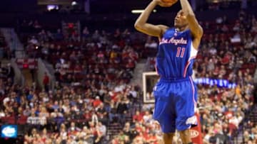 Oct 12, 2014; Portland, OR, USA; Los Angeles Clippers guard Jamal Crawford (11) shoots a three-point shot against Portland Trail Blazers at Moda Center at the Rose Quarter. Mandatory Credit: Jaime Valdez-USA TODAY Sports