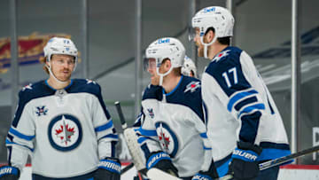 Mar 24, 2021; Vancouver, British Columbia, CAN; Winnipeg Jets forward Adam Lowry (17) and forward Mason Appleton (22) and forward Andrew Copp (9) celebrate CoppÕs fourth goal of the game against the Vancouver Canucks in the third period at Rogers Arena. Jets won 5-1. Mandatory Credit: Bob Frid-USA TODAY Sports