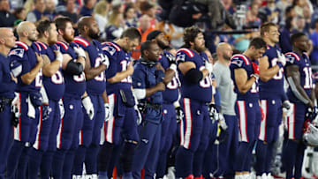 FOXBOROUGH, MA - OCTOBER 04: The New England Patriots stand for the national anthem before the game against the Indianapolis Colts at Gillette Stadium on October 4, 2018 in Foxborough, Massachusetts. (Photo by Adam Glanzman/Getty Images)
