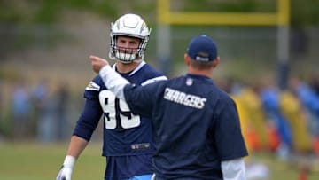 May 14, 2016; San Diego, CA, USA; San Diego Chargers defensive end Joey Bosa (99) listens to defensive line coach Giff Smith at Charger Park. Mandatory Credit: Jake Roth-USA TODAY Sports