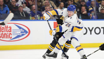 Nov 12, 2022; Buffalo, New York, USA; Buffalo Sabres defenseman Rasmus Dahlin (26) takes a shot on goal during the second period against the Boston Bruins at KeyBank Center. Mandatory Credit: Timothy T. Ludwig-USA TODAY Sports