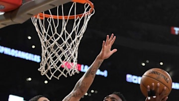 Denver Nuggets v Los Angeles LakersLOS ANGELES, CA - MARCH 13: Paul Millsap #4 of the Denver Nuggets attempts a lay up against Kyle Kuzma #0 of the Los Angeles Lakers on March 13, 2018 at STAPLES Center in Los Angeles, California. NOTE TO USER: User expressly acknowledges and agrees that, by downloading and or using this photograph, User is consenting to the terms and conditions of the Getty Images License Agreement. (Photo by Robert Laberge/Getty Images)Getty ID: 931668700