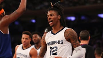 NEW YORK, NY - FEBRUARY 02: Ja Morant #12 of the Memphis Grizzlies reacts and claps against the New York Knicks on February 2, 2022 at Madison Square Garden in New York City. NOTE TO USER: User expressly acknowledges and agrees that, by downloading and or using this photograph, User is consenting to the terms and conditions of the Getty Images License Agreement. (Photo by Rich Graessle/Getty Images)