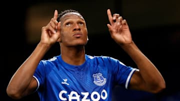 Everton's Colombian defender Yerry Mina (R) celebrates scoring their second goal during the English Premier League football match between Everton and Arsenal at Goodison Park in Liverpool, north west England on December 19, 2020. (Photo by Clive Brunskill / POOL / AFP) / RESTRICTED TO EDITORIAL USE. No use with unauthorized audio, video, data, fixture lists, club/league logos or 'live' services. Online in-match use limited to 120 images. An additional 40 images may be used in extra time. No video emulation. Social media in-match use limited to 120 images. An additional 40 images may be used in extra time. No use in betting publications, games or single club/league/player publications. / (Photo by CLIVE BRUNSKILL/POOL/AFP via Getty Images)