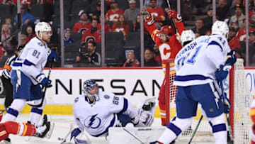 Mar 10, 2022; Calgary, Alberta, CAN; Tampa Bay Lightning goalie Andrei Vasilevskiy (88) is scored on by Calgary Flames forward Johnny Gaudreau (13) during the first period at Scotiabank Saddledome. Mandatory Credit: Candice Ward-USA TODAY Sports